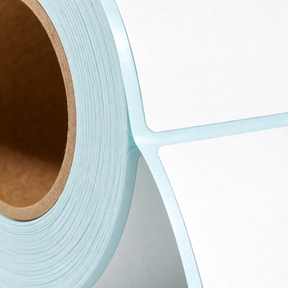 Permanent adhesive backing on direct thermal label roll
