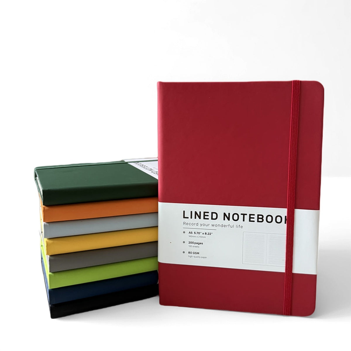 Assorted PU hardcover notebooks stacked together