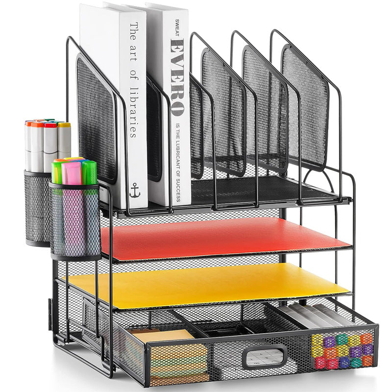 Black metal desktop file organiser with drawer and two pen holders; stationery shown for illustration